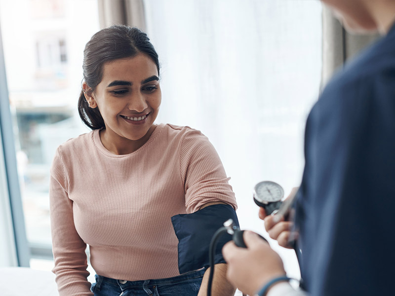 Woman getting her blood pressure taken