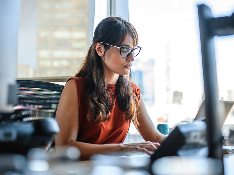 Woman at a desk on a laptop